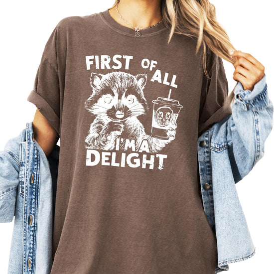 Side or lifestyle view of First of All I'm a Delight unisex raccoon shirt