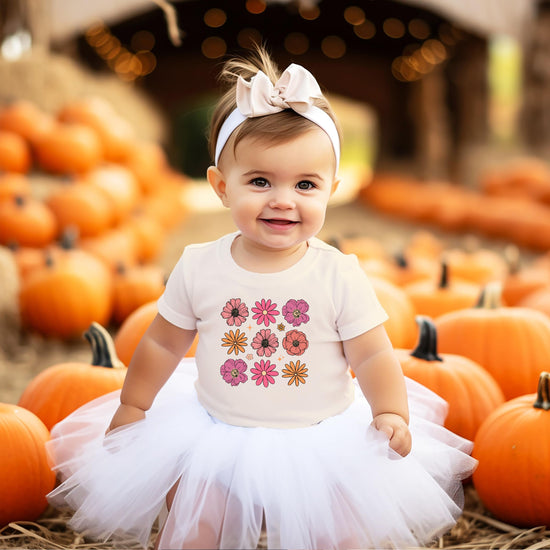 Toddler girls floral tee displayed to show fit and colorful flower design