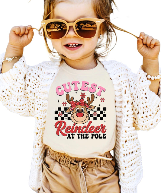 Front view of youth reindeer Christmas tee in natural color with festive holiday graphic print