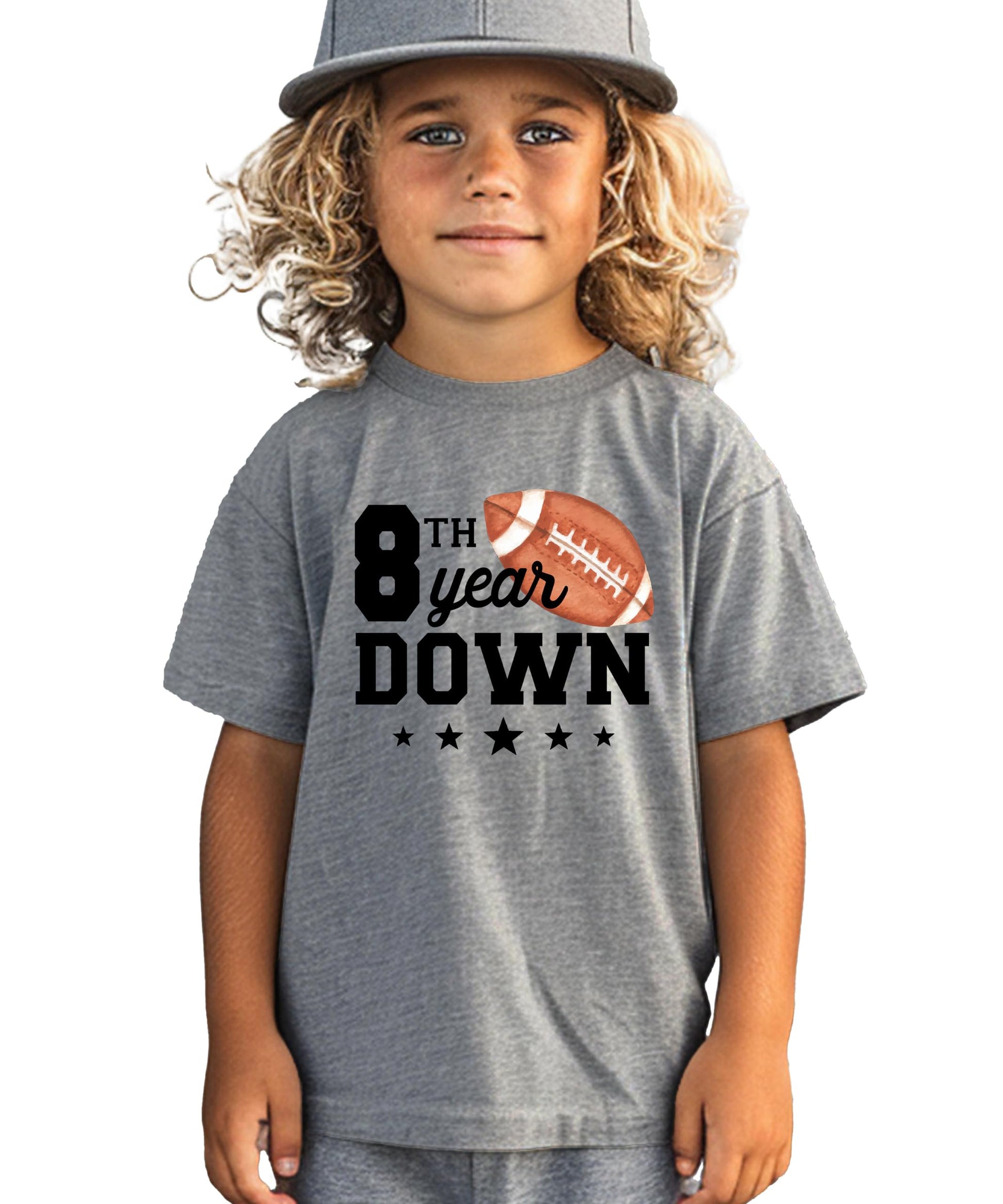 Close-up of '8th Year Down' football graphic print on youth birthday tee