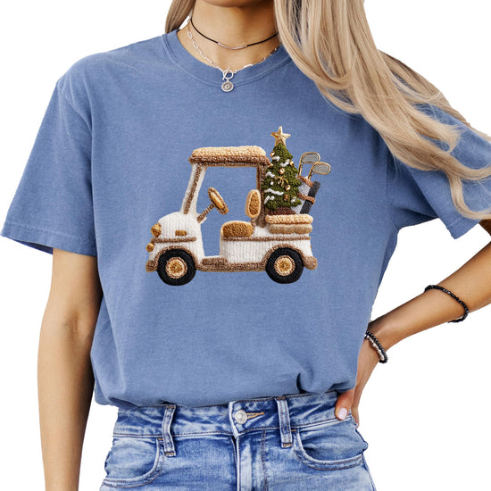 Flat lay or lifestyle shot of Olive Loves Apple Christmas golf cart graphic tee for women