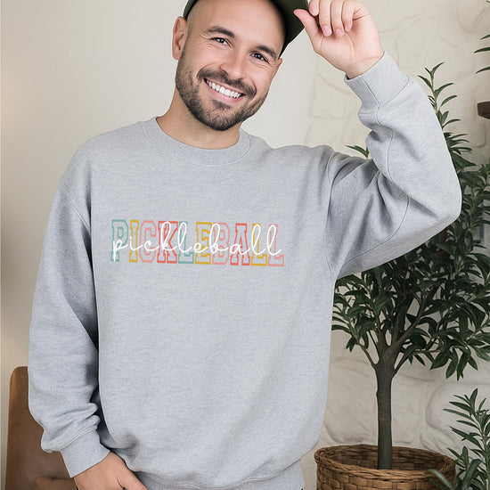 Flat lay of black unisex pickleball crewneck sweatshirt showing full design and fit