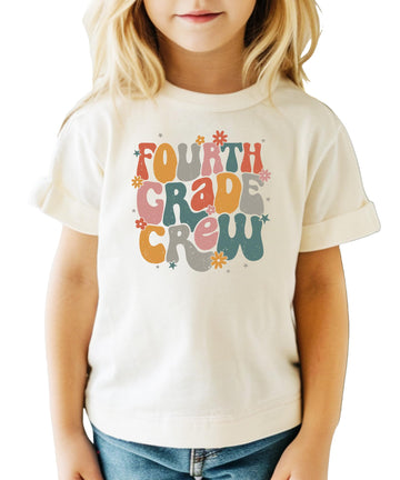 Fourth Grade Crew retro graphic t-shirt in peach with colorful text design