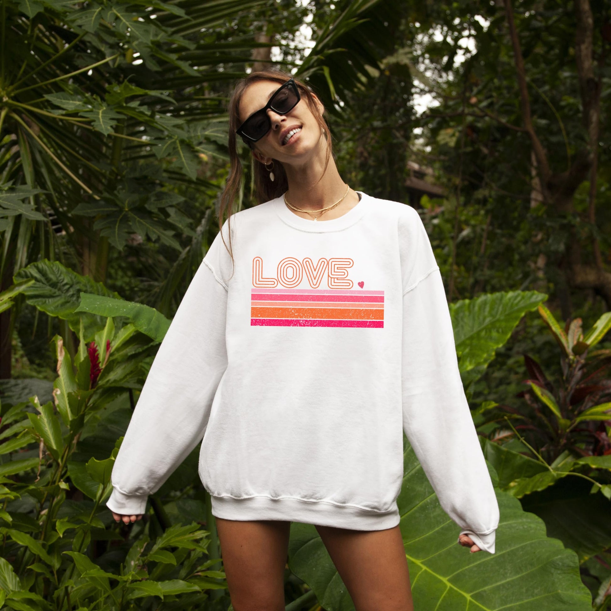 Side or lifestyle view of retro groovy Love sweatshirt for Valentine's Day