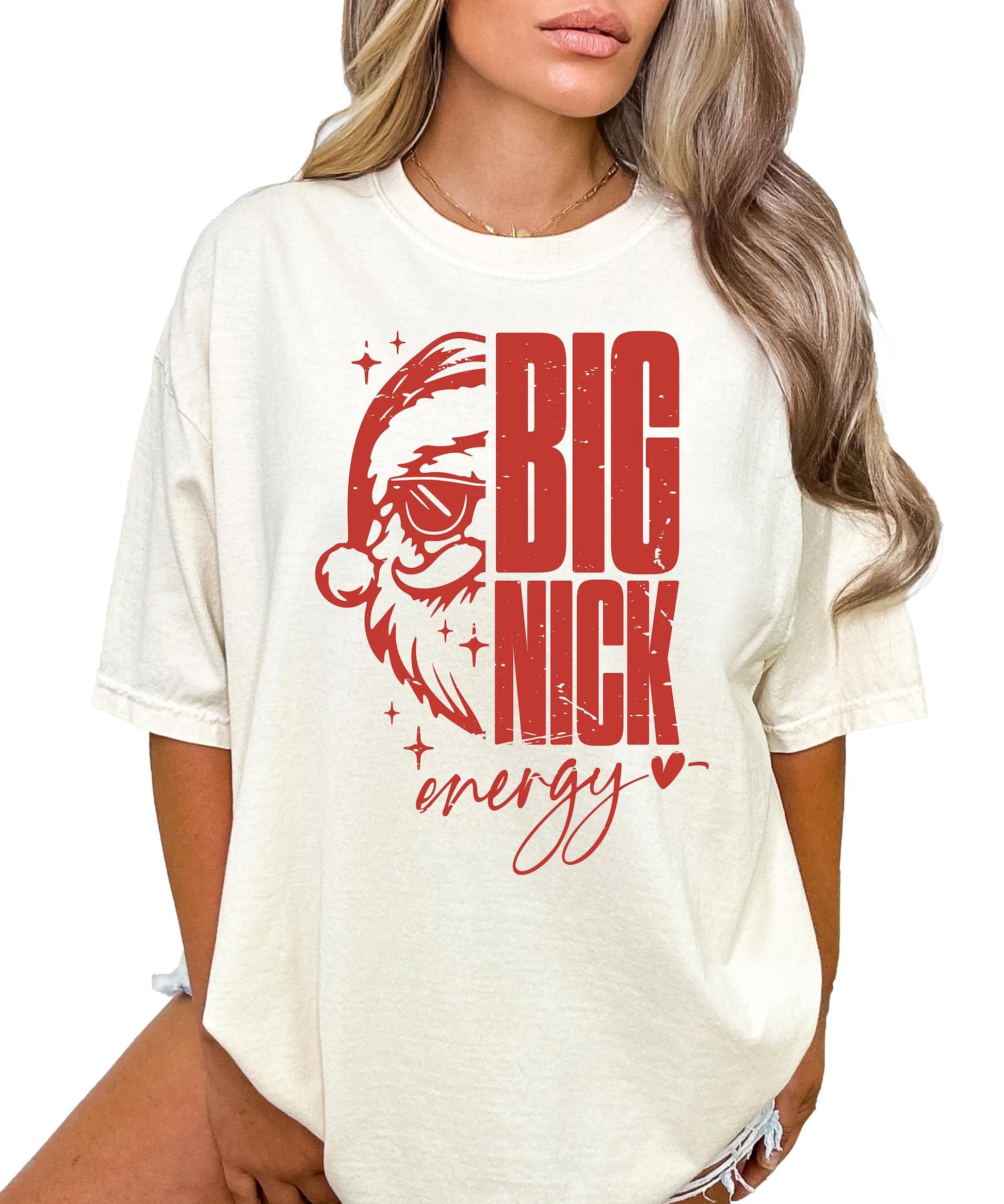 Close-up of Big Nick Energy graphic print featuring Santa in sunglasses on ivory shirt