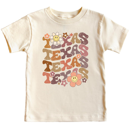 Full view of Texas game day graphic tee displaying retro-inspired TEXAS lettering with flower accents