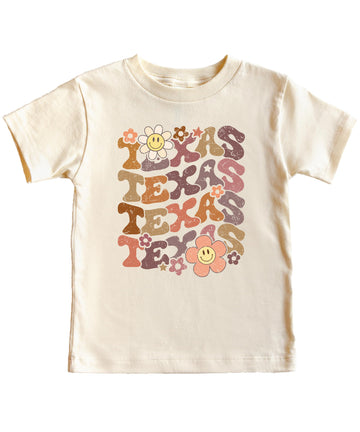 Full view of Texas game day graphic tee displaying retro-inspired TEXAS lettering with flower accents