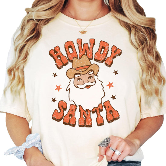 Detail shot of Howdy Santa western holiday graphic tee print quality on seafoam shirt