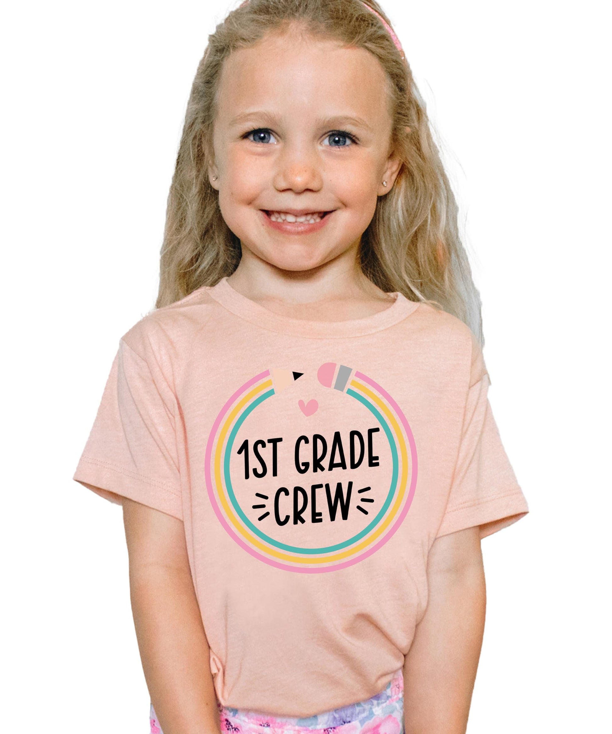 Flat lay of youth 1st grade pencil graphic tee by Olive Loves Apple