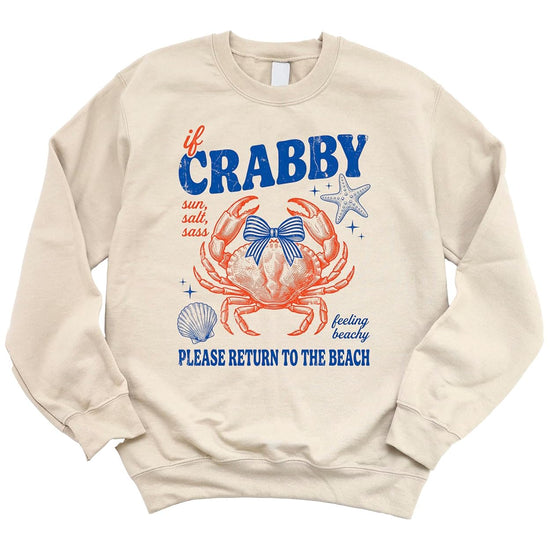Close-up of crab illustration with bow, starfish, and seashell accents on white fleece sweatshirt
