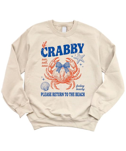 Close-up of crab illustration with bow, starfish, and seashell accents on white fleece sweatshirt