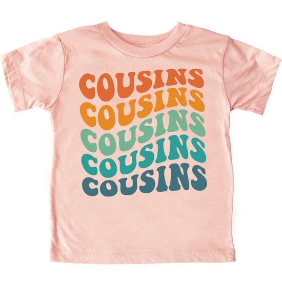 Close-up of cousins wavy groovy retro text design on kids shirt
