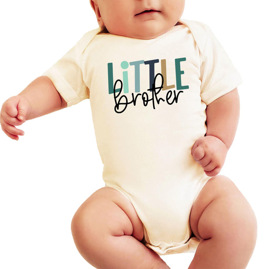 Little Bro baby bodysuit laid flat showing soft natural fabric and professional graphic print detail