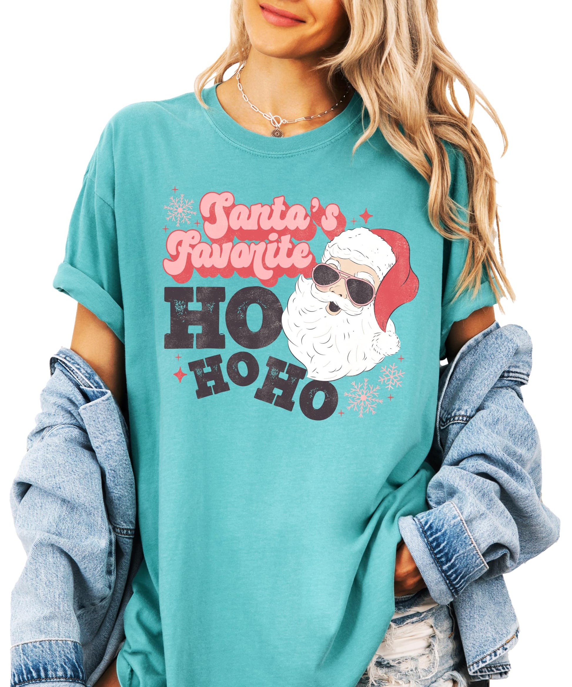 Close-up of retro Santa humorous graphic print on seafoam women's Christmas shirt