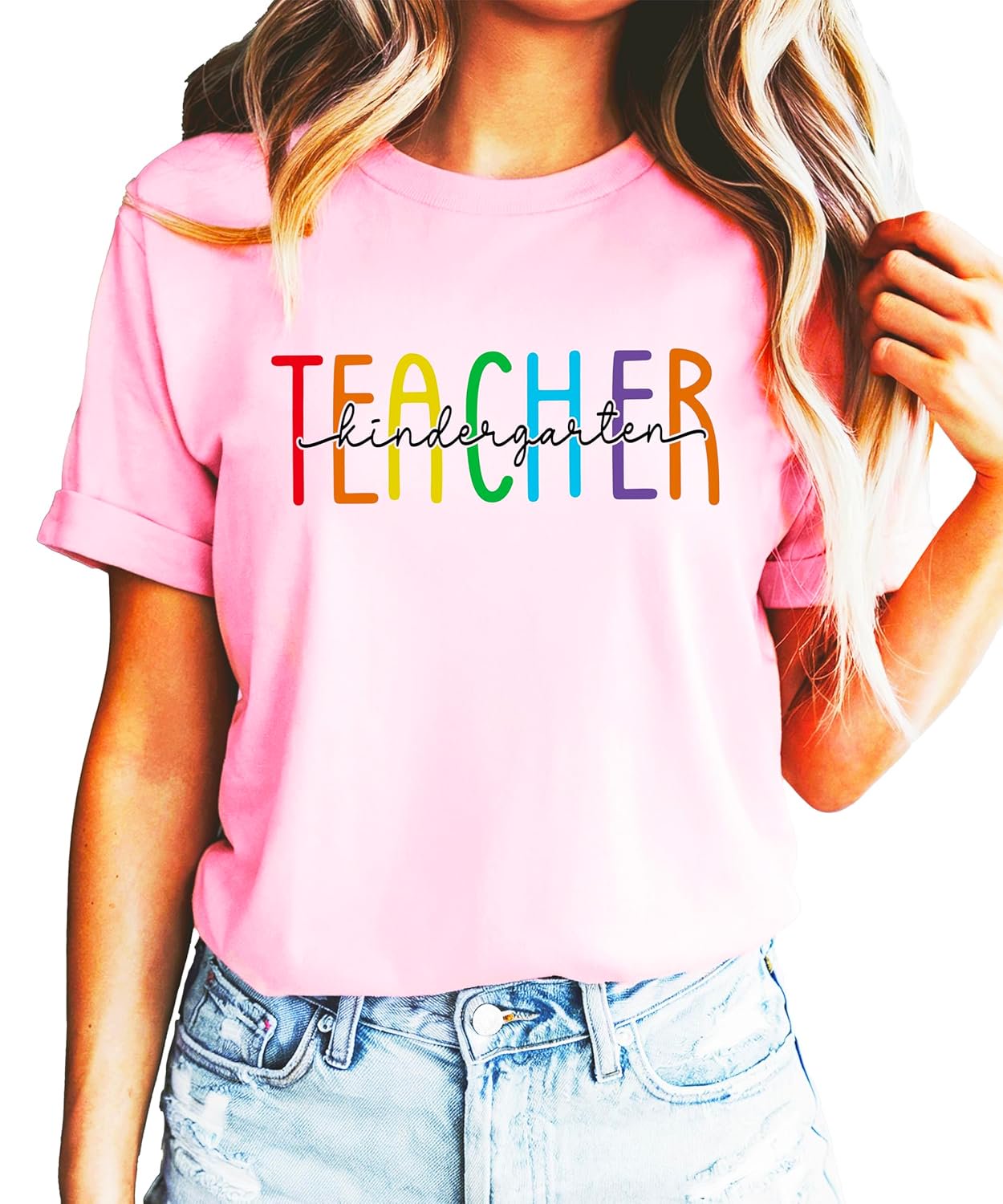 Front view of rainbow kindergarten teacher graphic tee in pink on female model