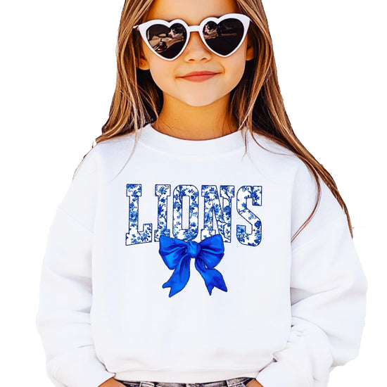 Side or lifestyle view of floral Lions sweatshirt styled for game day casual wear