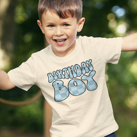 Birthday boy in groovy blue check graphic shirt, perfect birthday outfit for toddlers