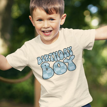 Birthday boy in groovy blue check graphic shirt, perfect birthday outfit for toddlers