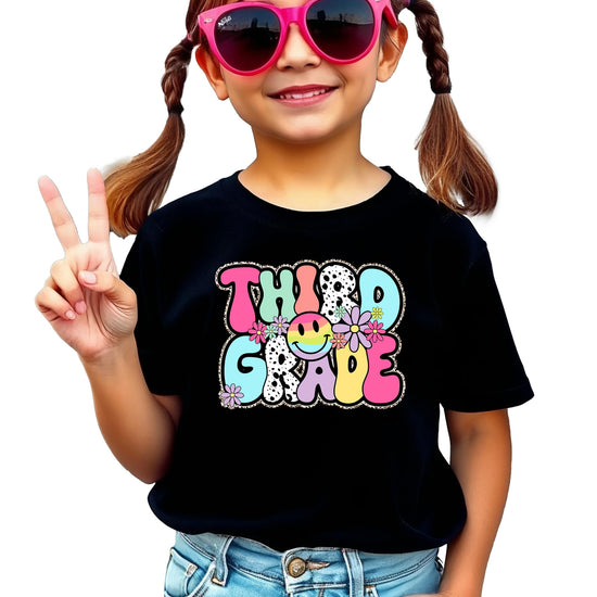 Close-up of groovy Third Grade shirt design showing retro bubble letters and floral details