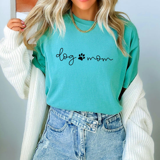 Side or back angle of women's Dog Mom graphic tee in seafoam green relaxed fit