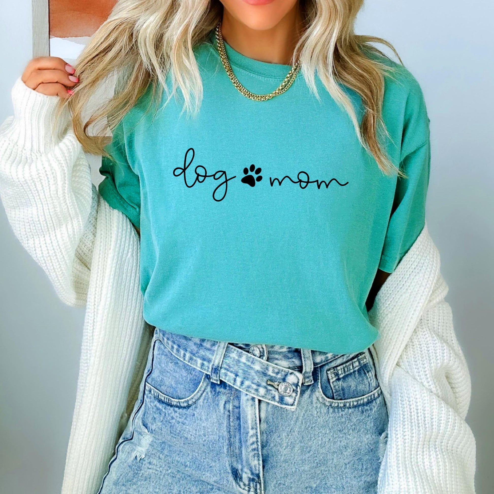 Side or back angle of women's Dog Mom graphic tee in seafoam green relaxed fit
