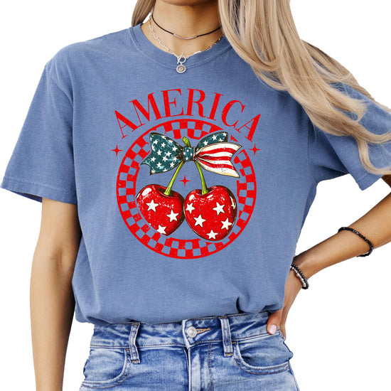 Side view of patriotic cherry bow tee showing shirt fit and design placement