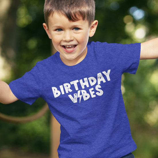 Boys birthday outfit featuring Birthday Vibes lightning bolt graphic tee in royal blue