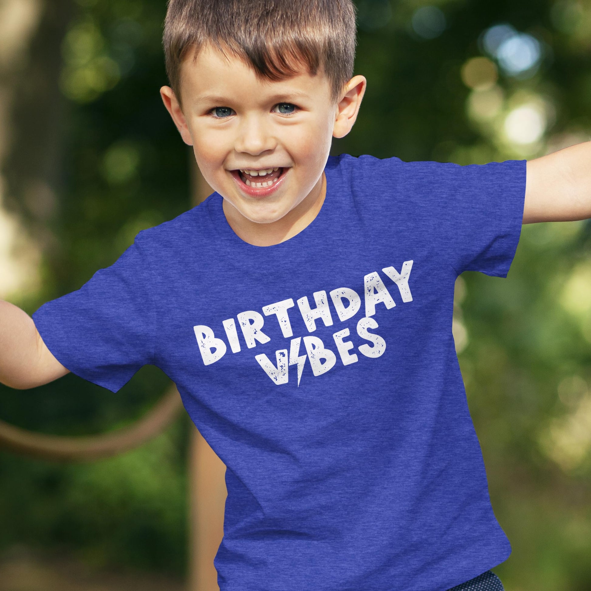 Boys birthday outfit featuring Birthday Vibes lightning bolt graphic tee in royal blue
