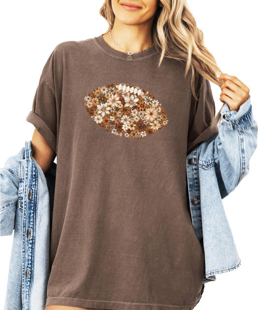 Woman wearing ivory floral football shirt showing fit and style