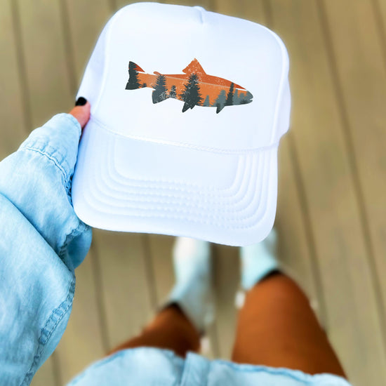 Trout fishing sunset trucker hat held in hand - white foam front snapback lifestyle photo