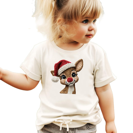 Close-up of knitted-style reindeer Santa hat graphic print on natural Christmas shirt