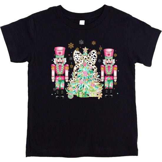 Front view of festive nutcracker Christmas tree graphic tee in peach for women and girls