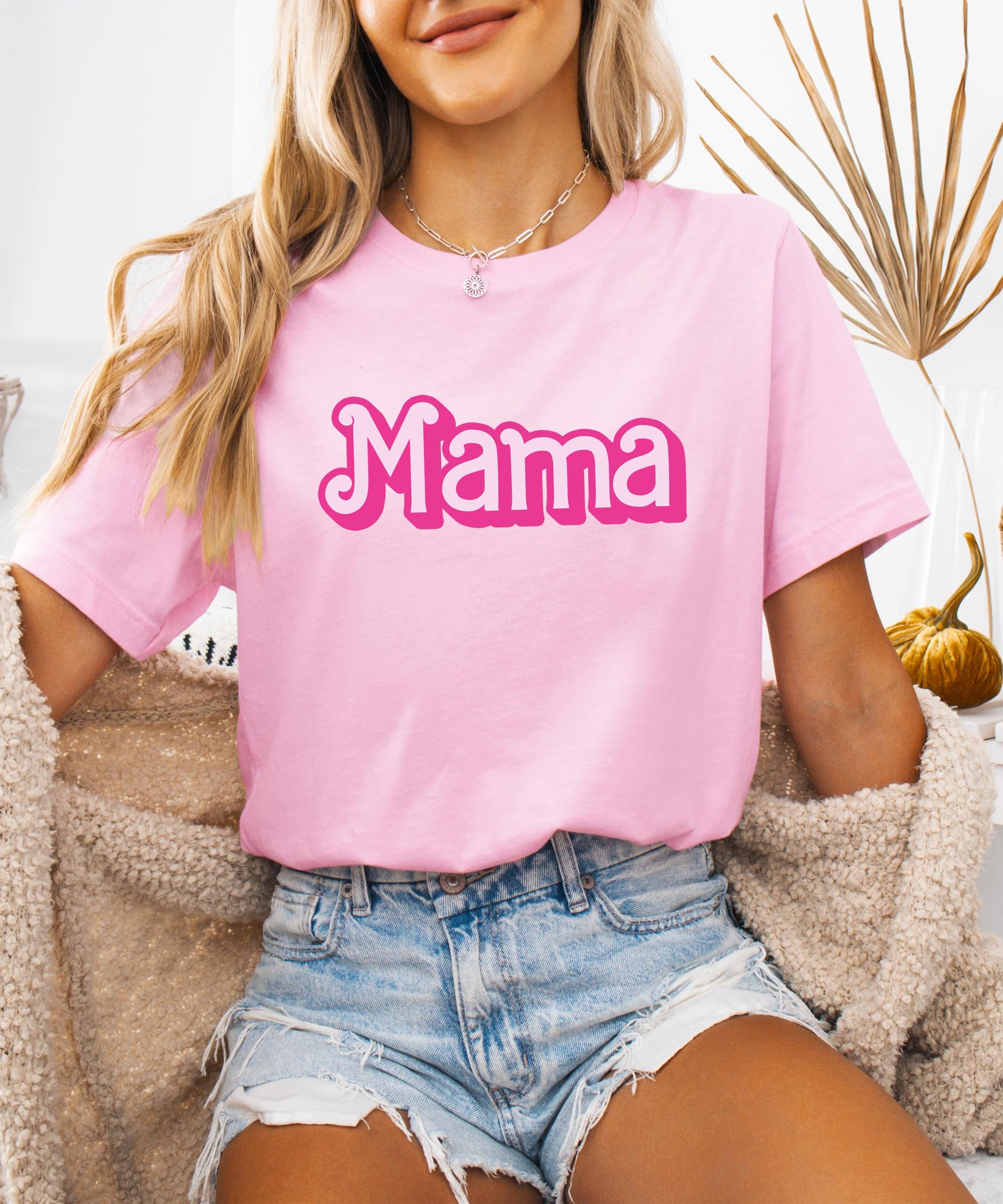 Mother and daughter twinning in pink matching graphic tees from Olive Loves Apple
