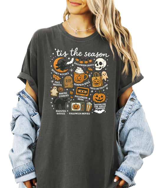 Women's black Halloween graphic tee with fall themed icons and text design