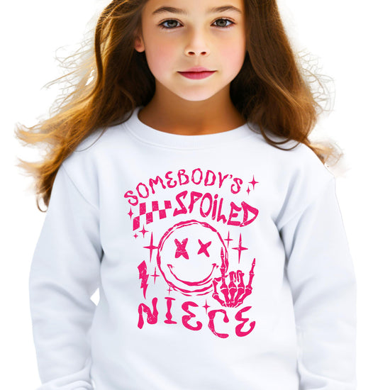 Olive Loves Apple Somebody's Spoiled Niece pink sweatshirt for kids and teens lifestyle shot