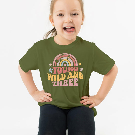 Flat lay of Young Wild Three 3rd birthday shirt showing full design