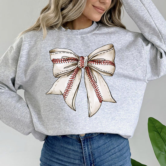 Detail shot of soft fabric and print quality on red baseball coquette bow sweatshirt