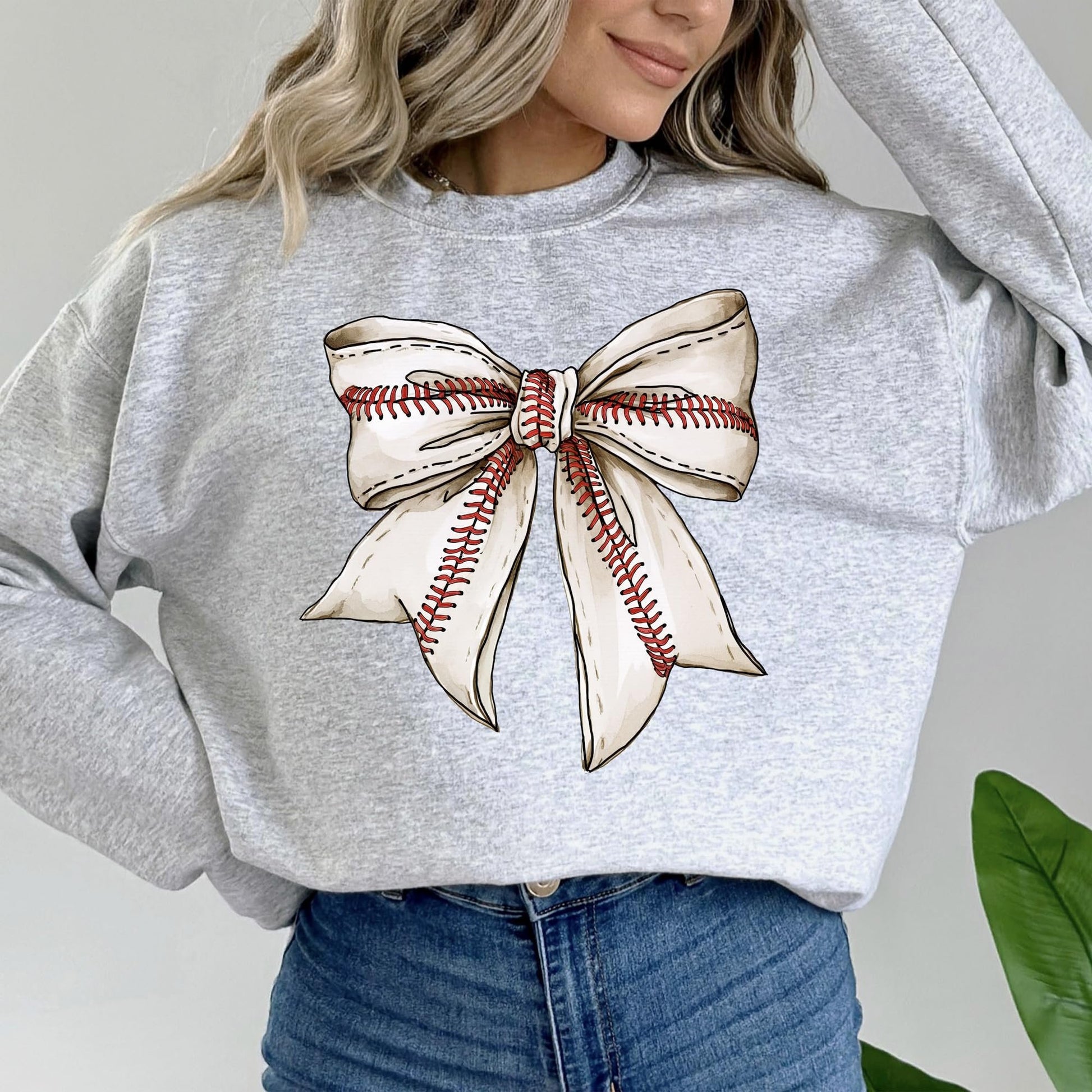 Detail shot of soft fabric and print quality on red baseball coquette bow sweatshirt