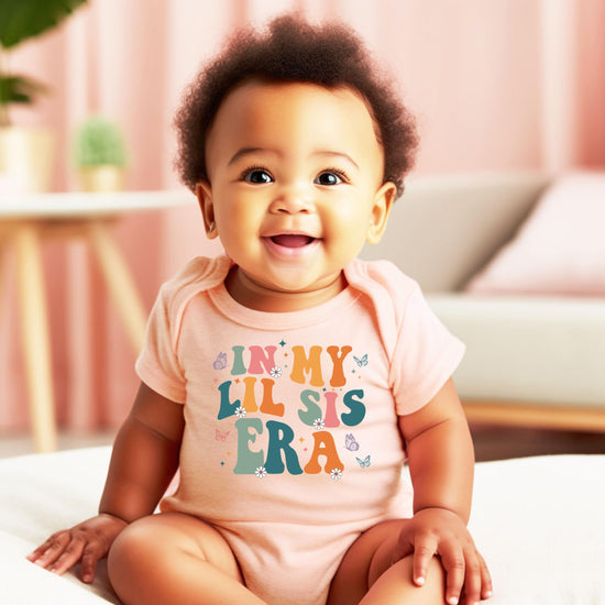 In My Lil Sis Era baby one-piece bodysuit styled for spring sibling announcement or baby shower gift