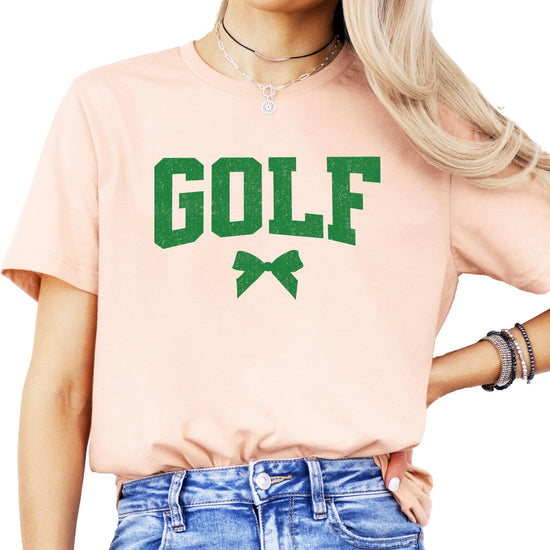 Olive Loves Apple golf coquette bow shirt for women and teens, lifestyle shot