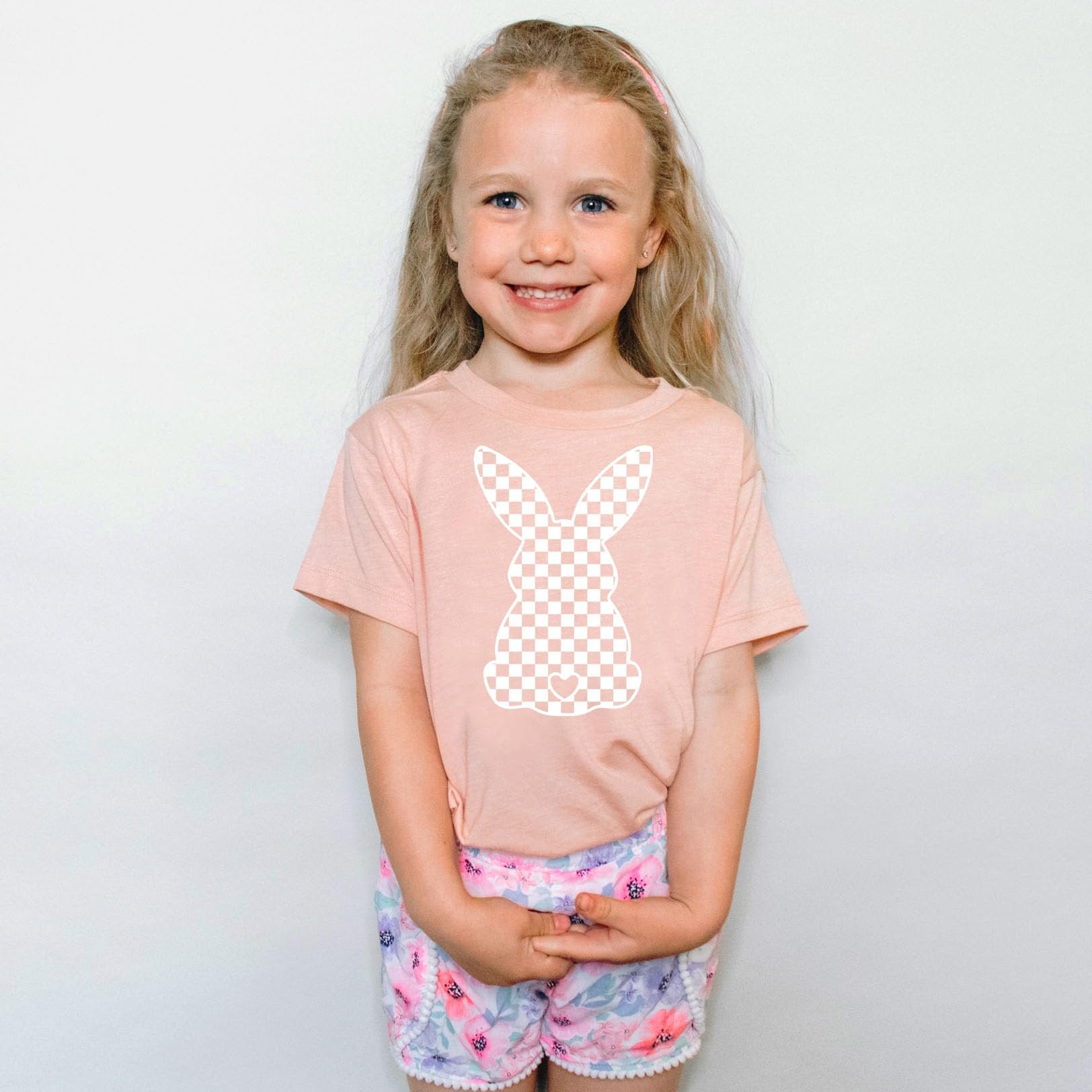 Detail shot of soft peach girls bunny checkered Easter shirt graphic