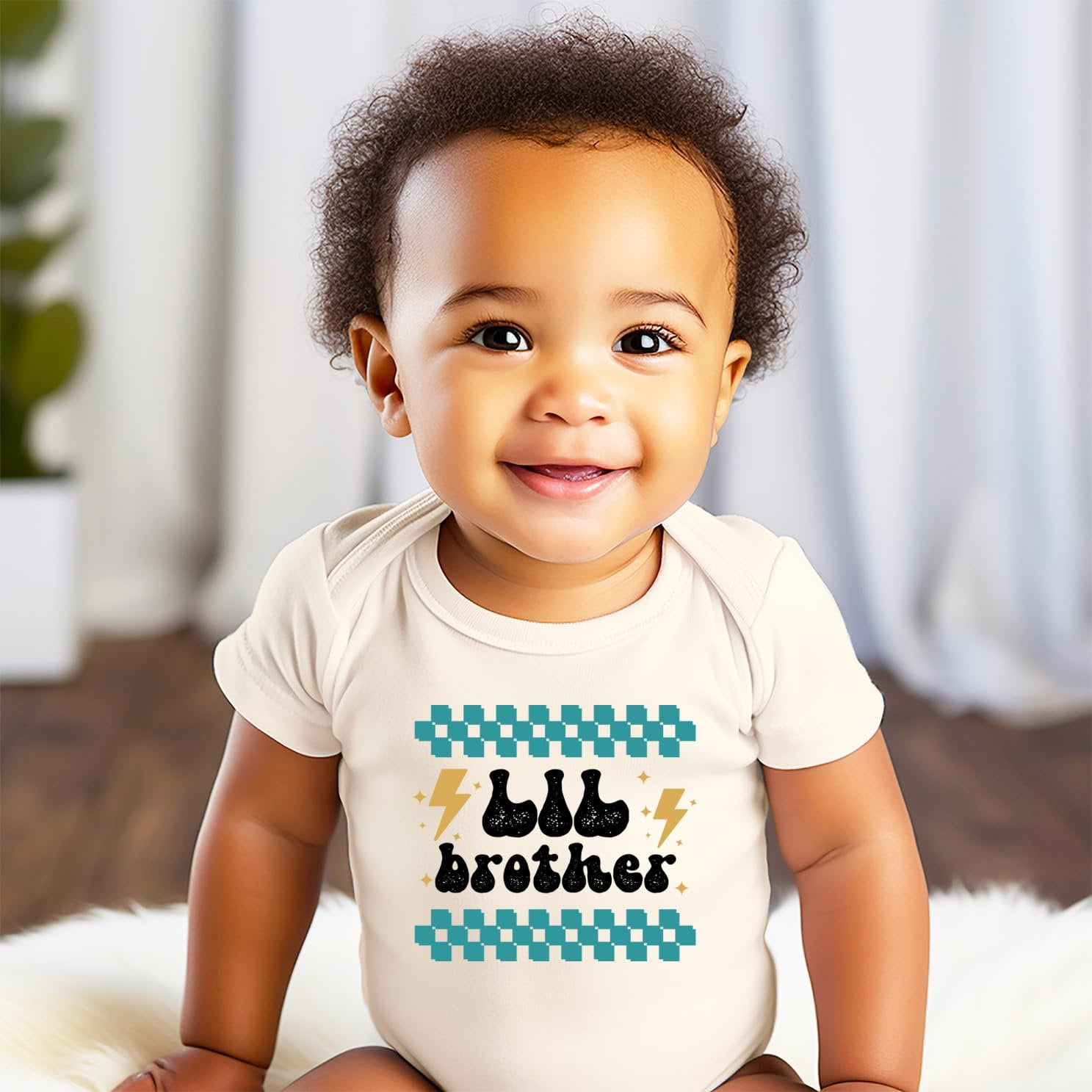 Close-up of retro lightning bolt little brother print on natural toddler tee