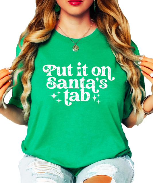 Front view of red 'Put It On Santa's Tab' funny Christmas shirt for women