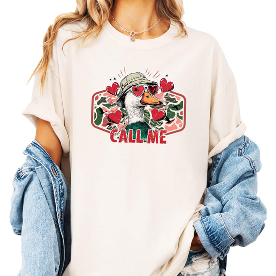 Flat lay of Olive Loves Apple duck hunting Valentine's Day unisex graphic tee