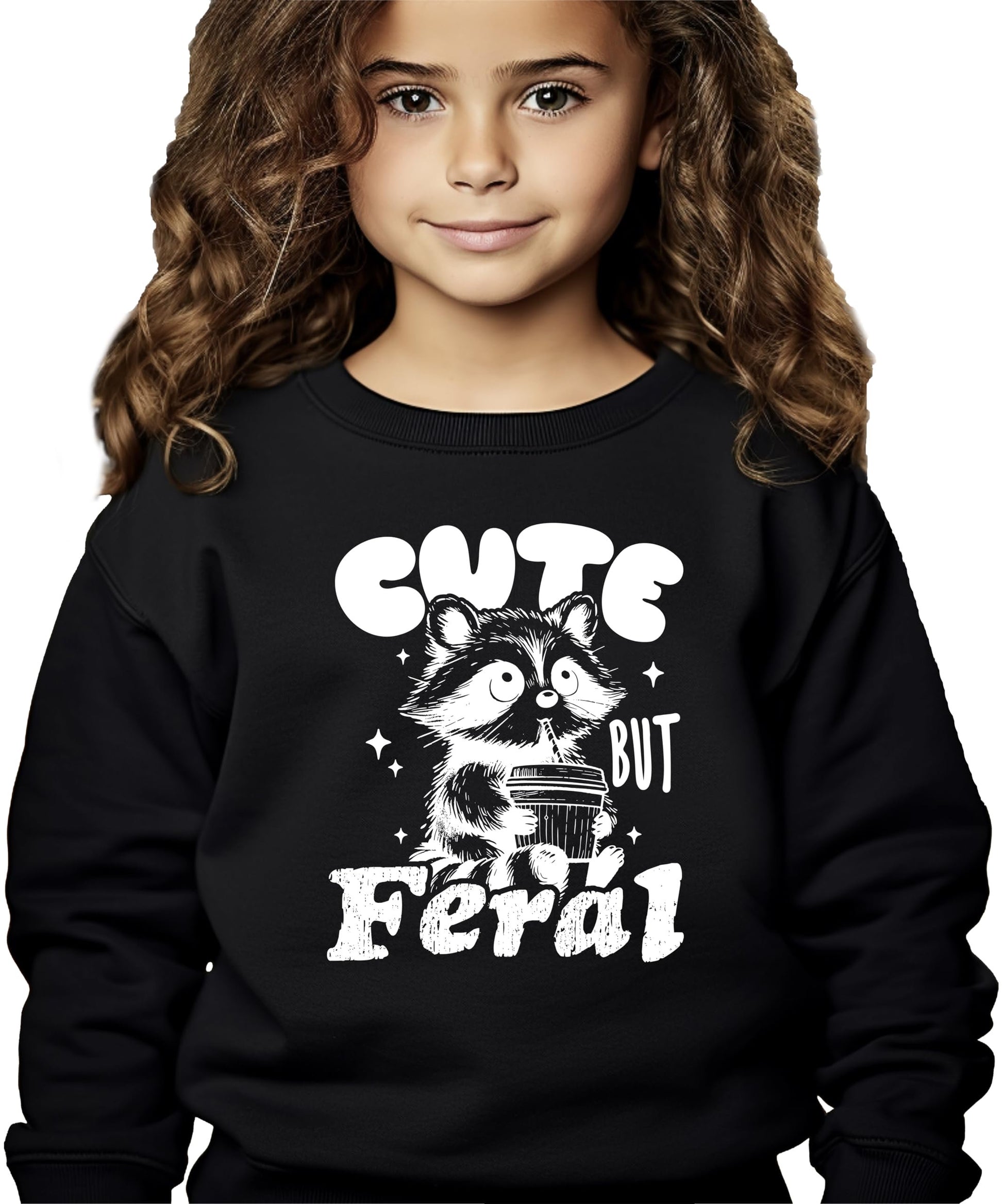 Detail shot of the raccoon graphic and Cute But Feral text on a kids pink sweatshirt
