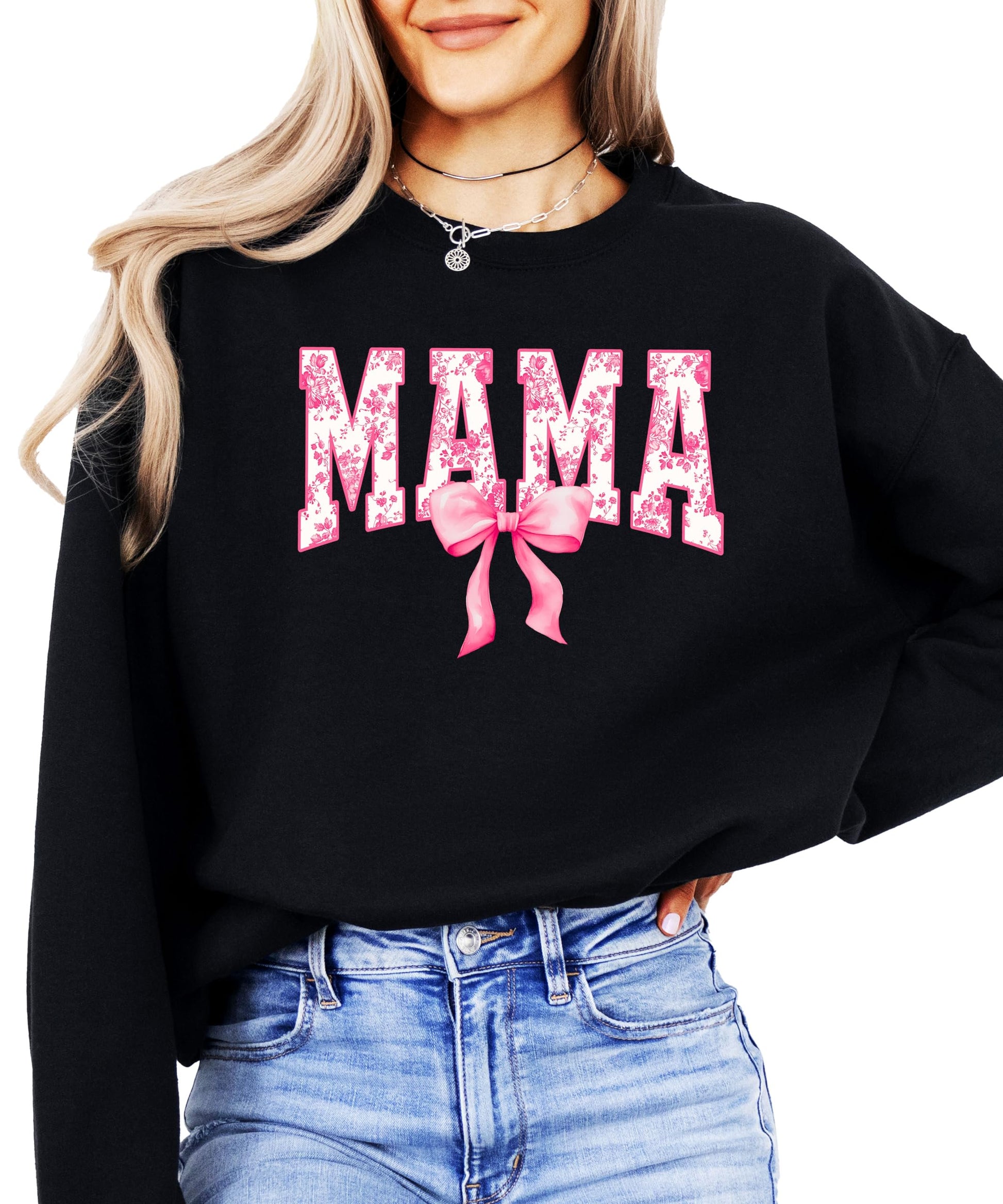 Woman wearing black Mama sweatshirt with cute pink bow design