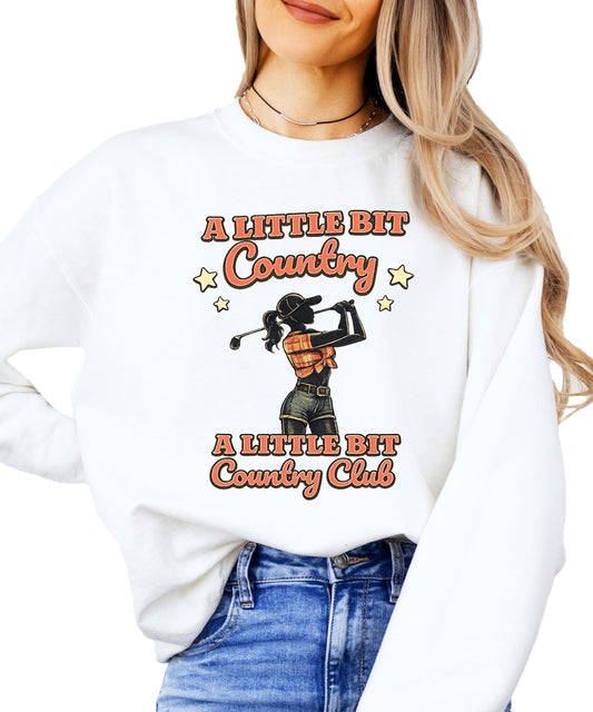Close-up of Western golf graphic on gray sweatshirt showing cowgirl golfer design and bold lettering