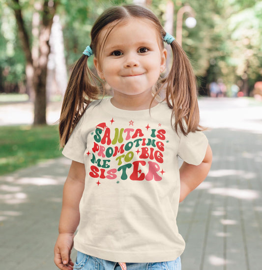 Santa is Promoting Me to Big Sister Groovy Christmas T-Shirt for Baby and Toddler Youth Girl Holiday Outfit Natural Shirt Youth Large