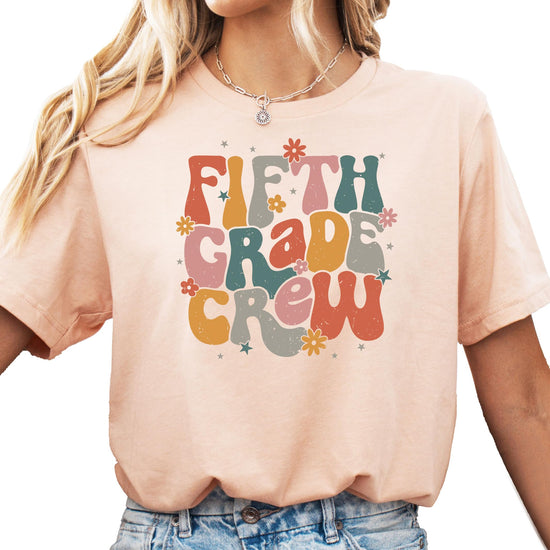 Second grade school shirt size and fit guide display on peach tee