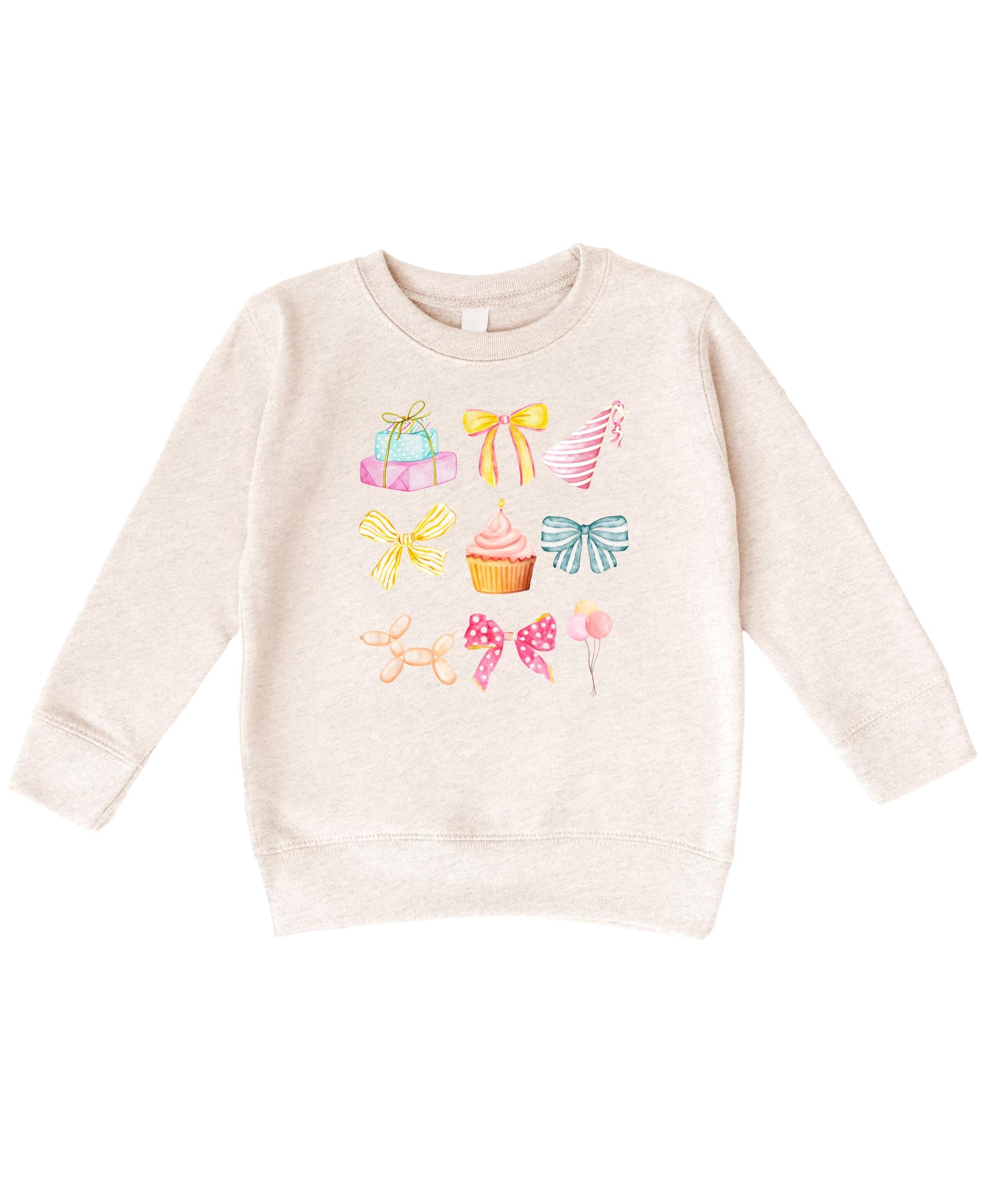 Close-up of pastel coquette birthday graphic on kids sweatshirt featuring bows, cupcakes, and balloons